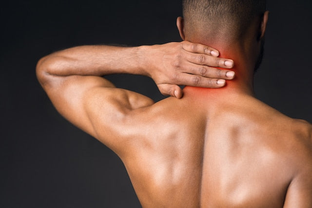 man suffering from pain in neck