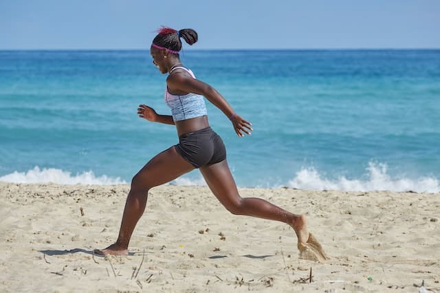 A woman running on a beach