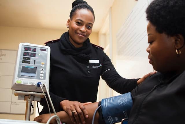 A woman checking her blood pressure