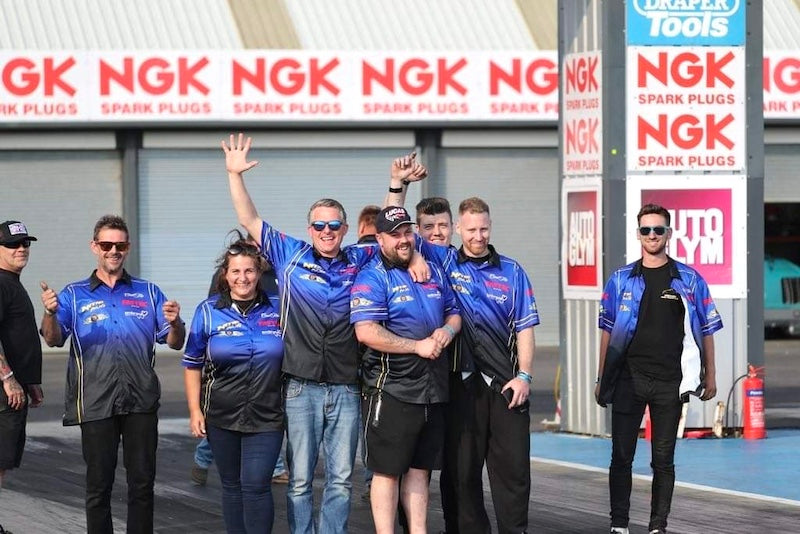 Nitro Bug Funny Car team on the strip at Santa Pod raceway.