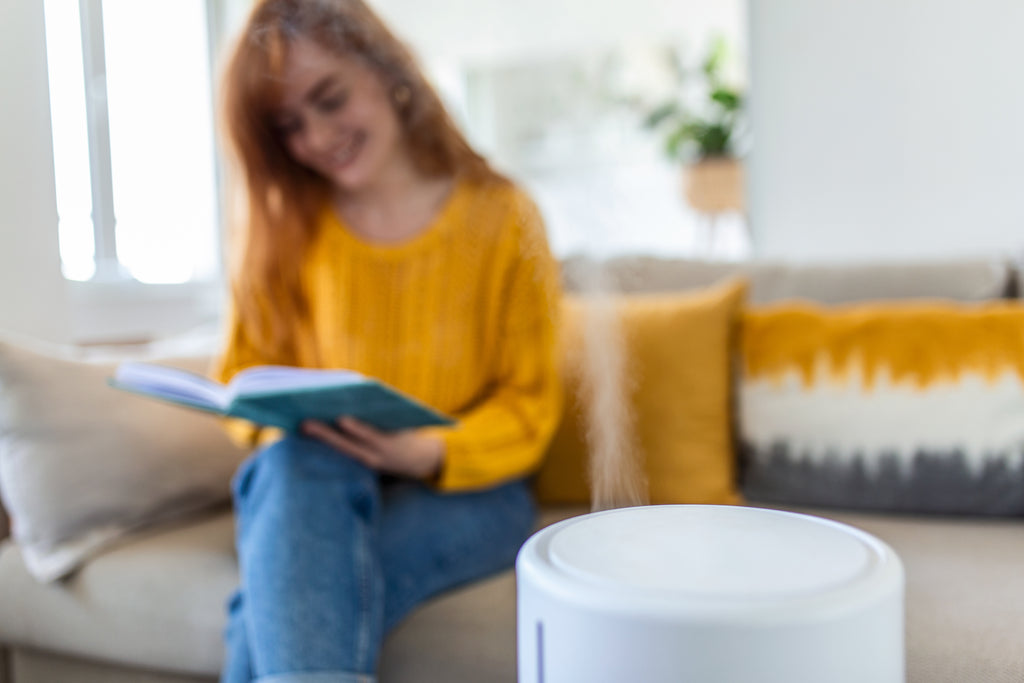 Woman In Yellow and Air Purifier