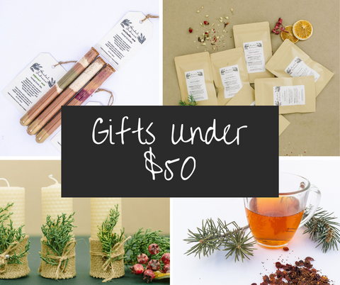 gifts under 50 dollars healthy hot chocolate mix in glass vial cork stopper gift set herbal tea sample set beeswax candles with juniper sprigs pine needle tea