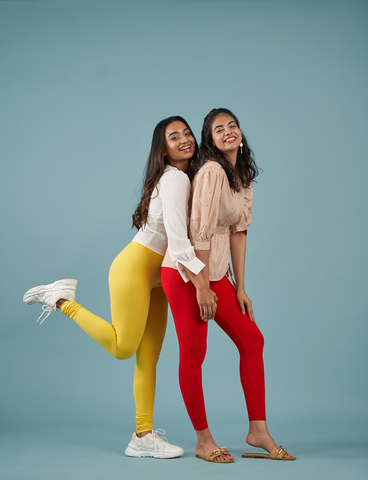 Two girls wearing red colour Leggings