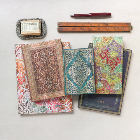 An assortment of day planners with colorful cover designs