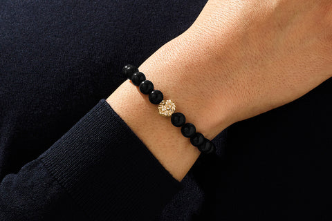 Black and gold bracelet with lion head