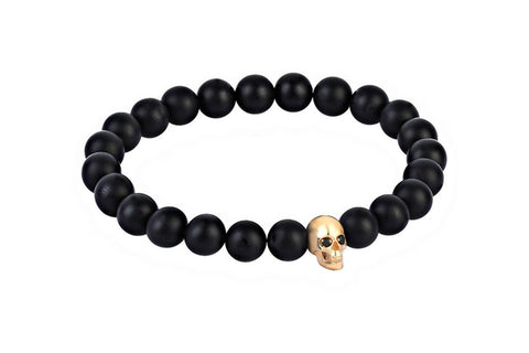 Black bracelet with gold skull