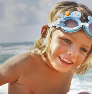 Little boy wearing swim goggles