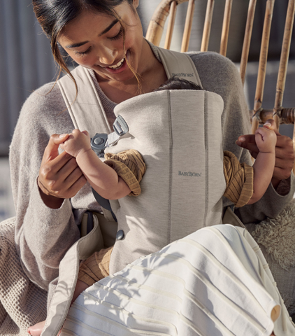 Woman with baby in Baby Bjorn carrier