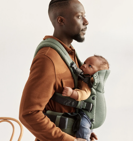 Man front carrying baby with best infant carrier 2024