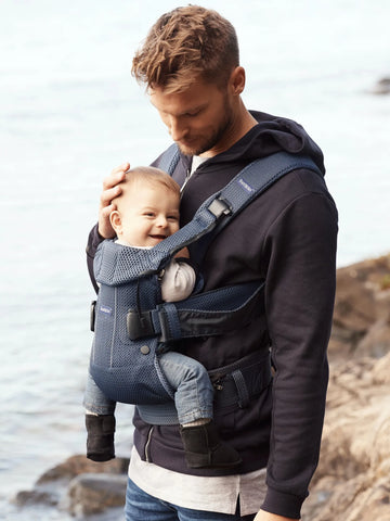 Man front carrying his baby with best infant carrier 2024