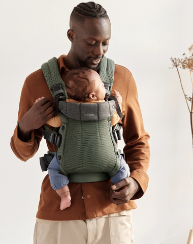 Man carrying baby with Baby Bjorn Harmony