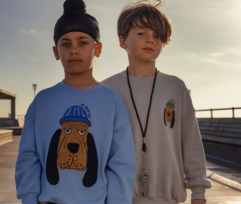two boys wearing Mini Rodini Adored clothing collection