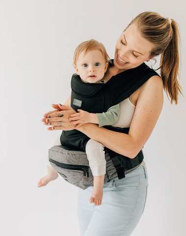 Woman enjoying a bonding moment with best infant carrier 2024