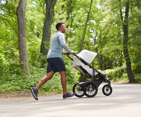 Man jogging with Uppababy ridge stroller