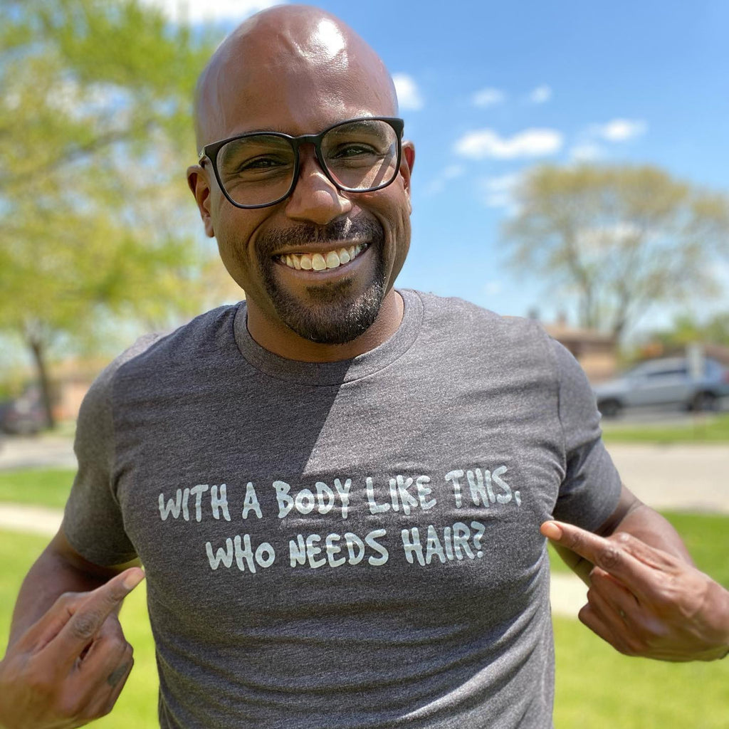 Tony Williams wearing "with a body like this who needs hair" tee