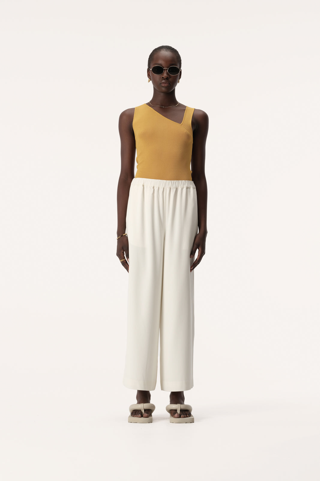 Roth Sleeveless Knit Top with Asymmetric Neck in Marigold | Elka Collective