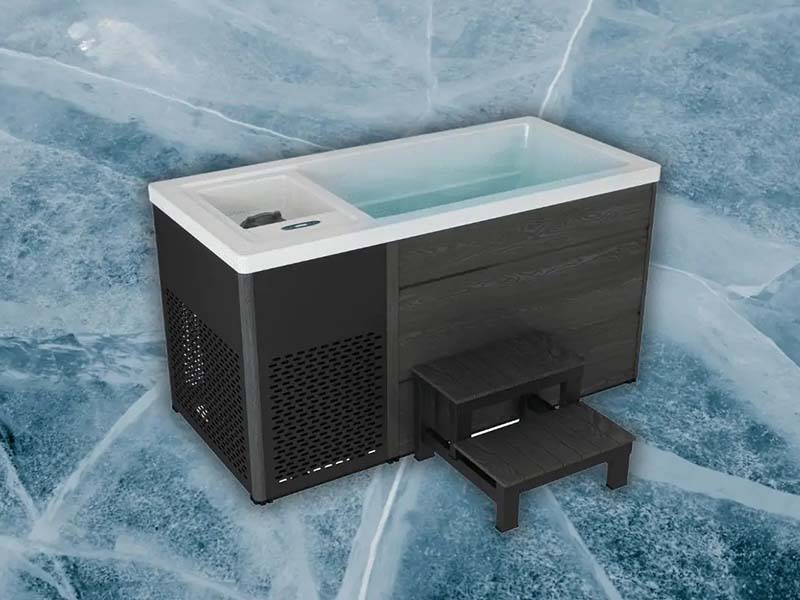 Chillax Ice Bath on a frozen background, showcasing its compact design and steps.