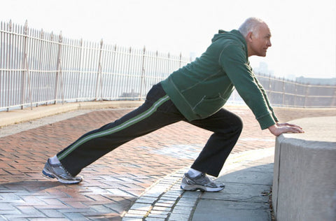 senior-man-stretching-cleveland-clinic-health-essentials