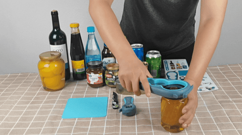 Person using the Opener for opening various jars and bottles