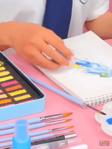 Student using water colour
