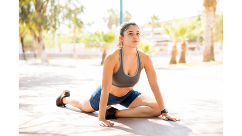 girl warming up stretching muscles before exercise