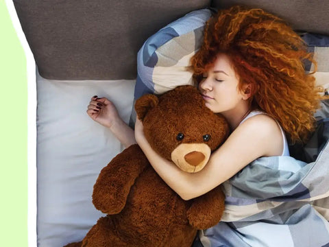 woman hugging teddy bear