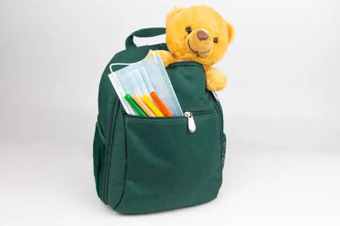 a plushie in a school bag