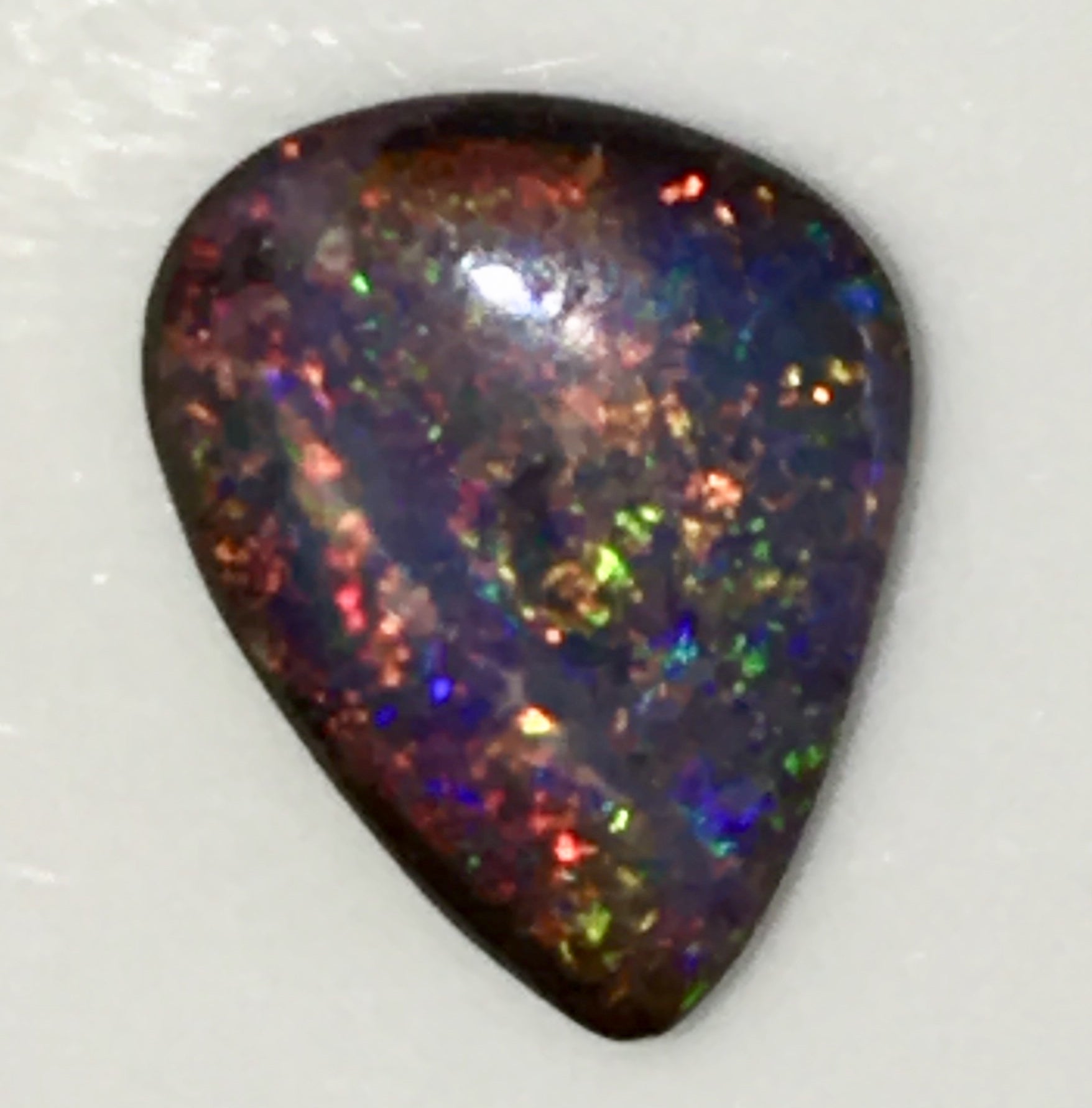 Multi coloured solid boulder opal