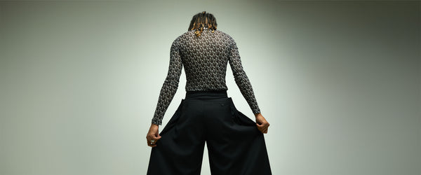 Feng Chen Wang Blog Post Banner 2 Man in wide Black Pants shown from the Back