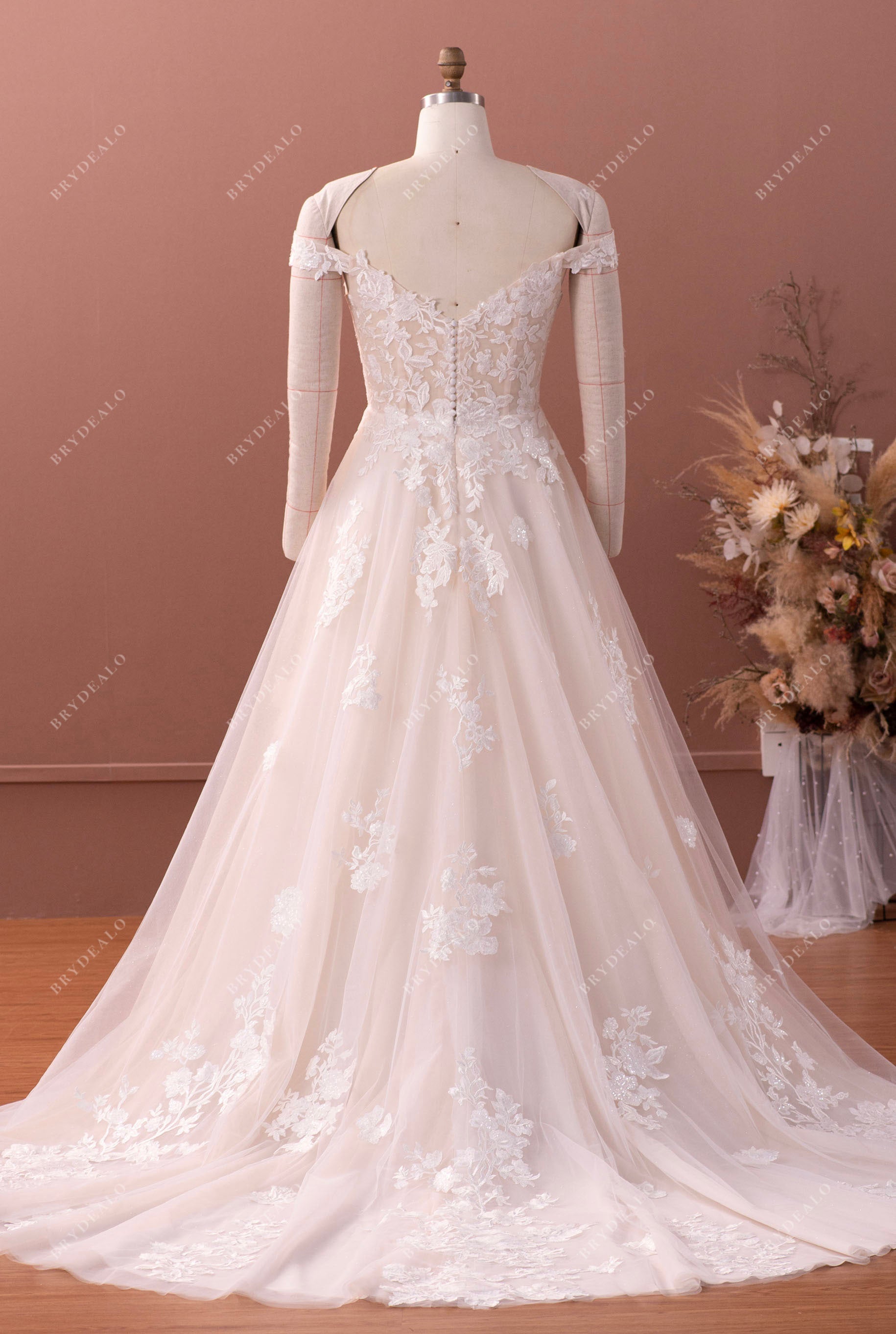 https://cdn.shopify.com/s/files/1/0707/0469/3565/products/off-shoulder-lace-A-line-wedding-dress_d347c185-a801-43d0-b27e-b28367a4b729.jpg?v=1683501072