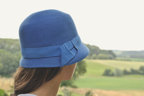 https://cdn.shopify.com/s/files/1/0707/0708/5620/products/Bronte-cloche-hat-royal_20blue_a28f93dd-a6c2-4bd5-801a-ff3ba66189f1_600x.jpg?v=1676395540