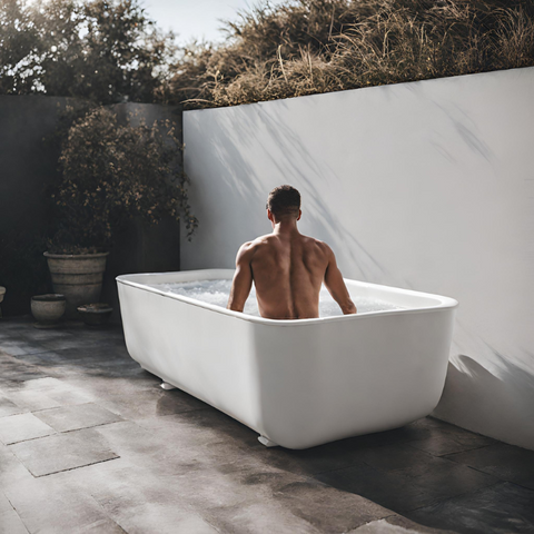 Man taking a Cold Plunge on a White Tub