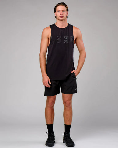 LSKD model in black rep 7 inch shorts and black LSKD tank 