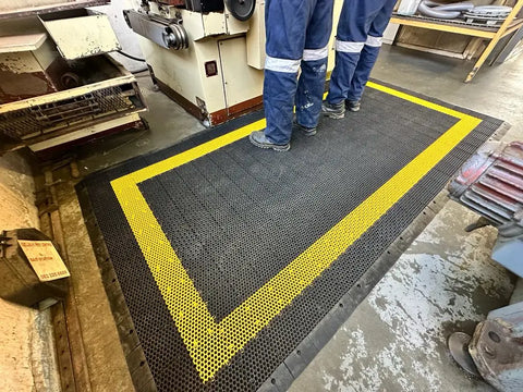 Man working on anti fatigue mat