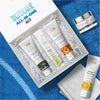 All-in-one skincare kit with face wash, serum, and cream in an open box