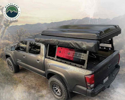 Overland Vehicle System Mounted Bed Rack With Cargo On Top