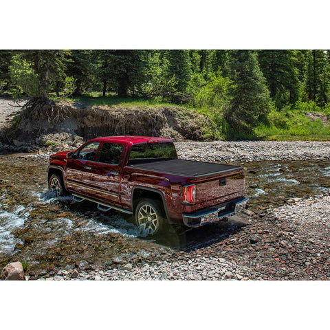 GMC PowertraxPRO XR Tonneau cover on a red truck in a lifestyle view