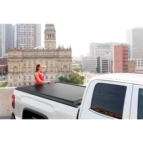 View of the truck with retractable tonneau cover including a model