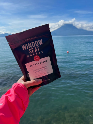 Bag of coffee in Guatemala with mountain in background