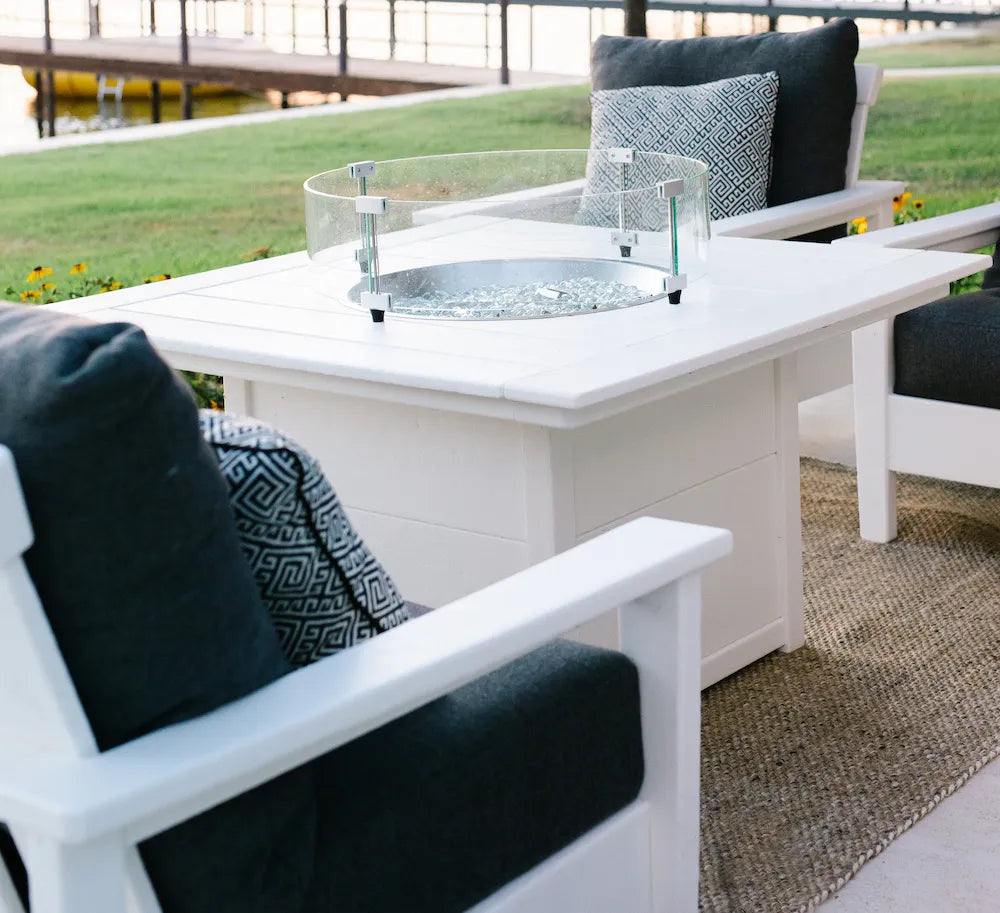 POLYWOOD Prescott Deep Seating Chairs in White and Midnight Linen surround a Square 42 Inch Fire Pit Table in White.