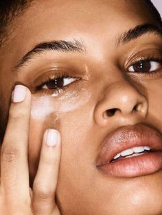 woman applying eye cream