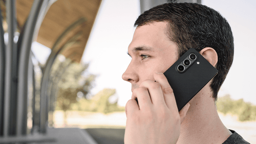 a man holding galaxy z fold 5 aramid fiber ultra thin case making phone call