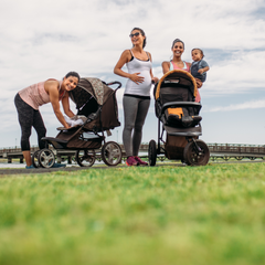 Women and mothers exercising together in the park