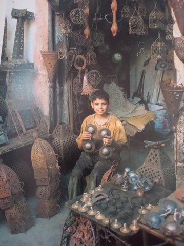 child working on metalwork in morocco