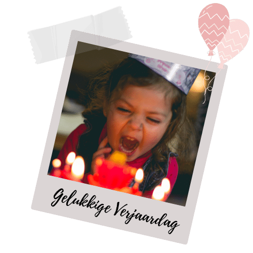 Young girl blowing candles on birthday cake