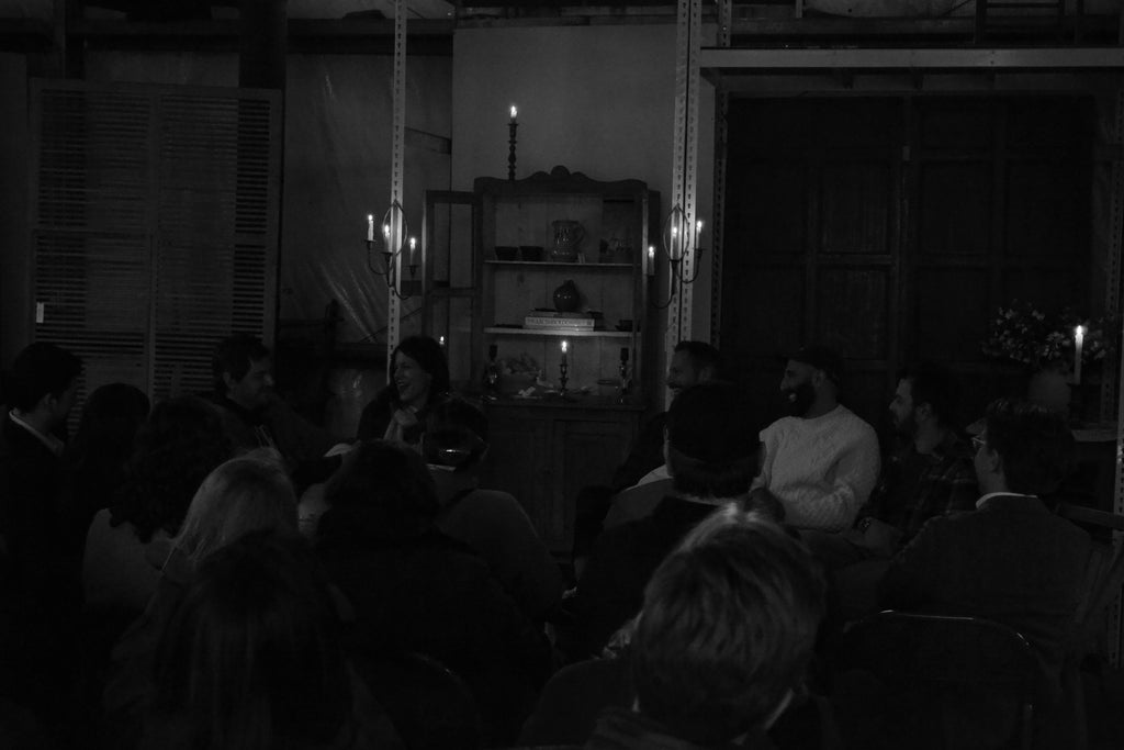 As the light dimmed, the candles glowed for the Cheap Old Houses event at Quittner, bringing the conversation in close. 