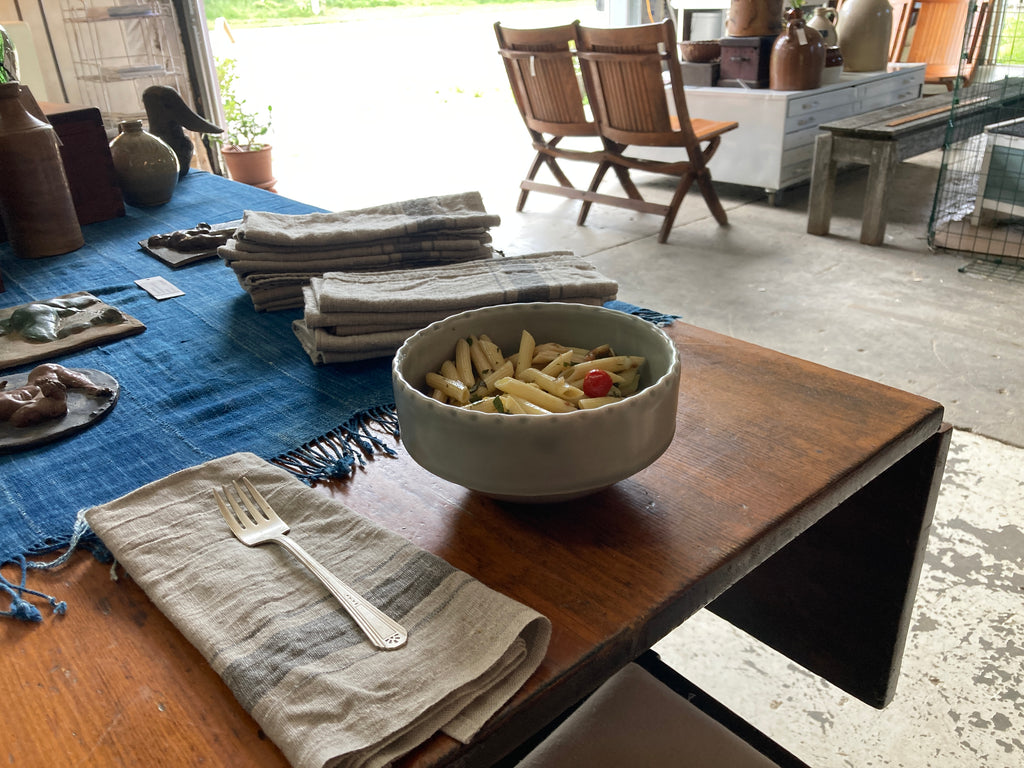 Summer pasta salad in Palatine Collection bowl in smoke with our Rustic Linen napkin and a vintage indigo