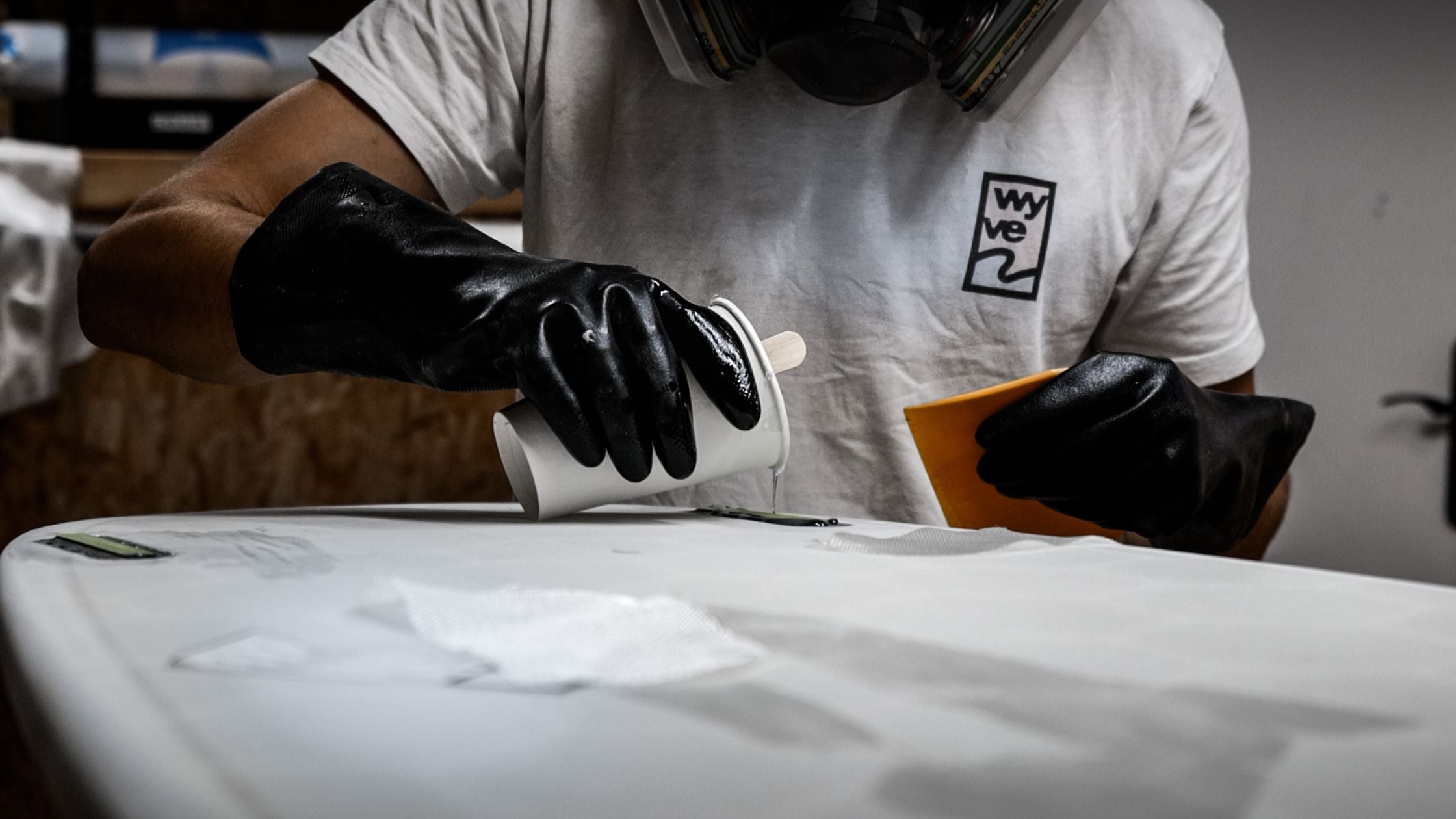 Surfboard Shaper glassing a Wyve 3D Printed Surfboard