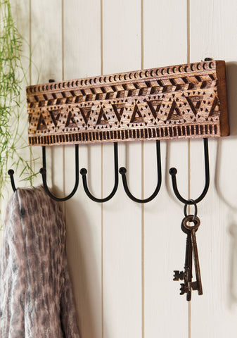 handcarved long wooden coat rack aztec design made by artisans in india 