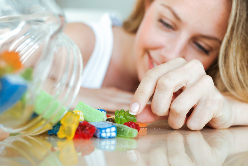 Adult Female Eating Children Gummies